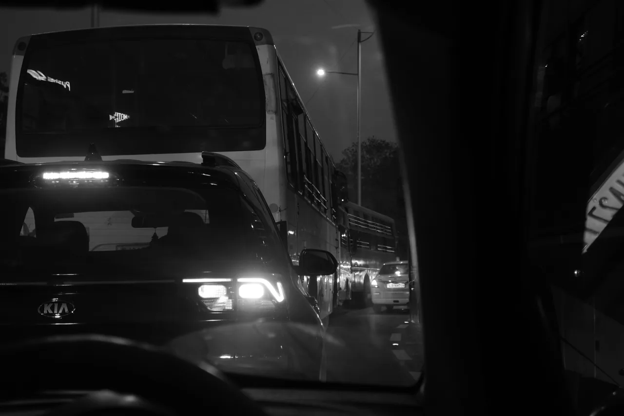 Headlights shining through dark city traffic