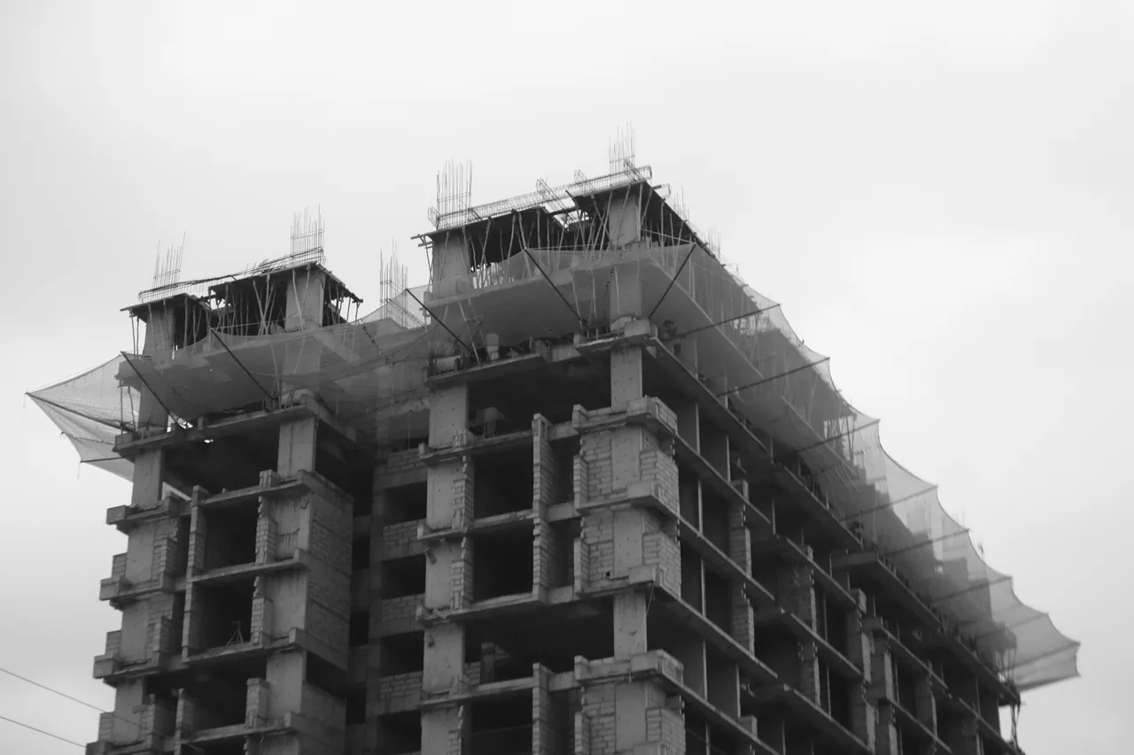 The exposed concrete floors of an unfinished building
