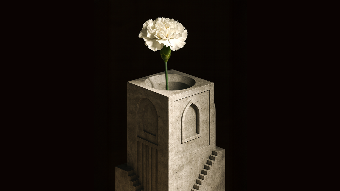 A white flower in an architectural concrete vase against a dark background
